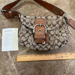 Good used condition small coach pocketbook.